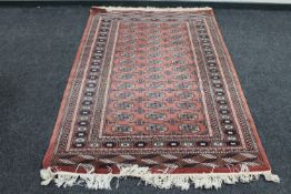 A Bokhara rug on peach ground,