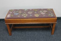 An oak framed tapestry seated duet stool