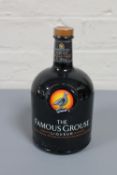 The Famous Grouse Liqueur, an infusion of citrus fruits, spices, Scotch & Bourbon Whiskies. 1 litre.