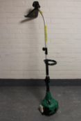 A Gardenline petrol strimmer