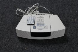 A Bose Wave radio with remote control