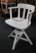 A white swivel desk chair