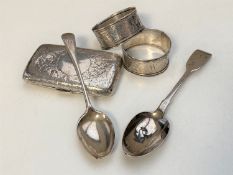 A quantity of silver items : cigarette case, napkin rings,