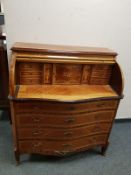 A reproduction inlaid cylinder bureau,