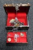 A wooden chest of costume jewellery, dress rings,