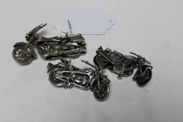 Three continental miniature silver motorbikes,