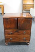 An Edwardian mahogany storage cabinet