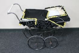 A mid 20th century Silver Cross coach built pram