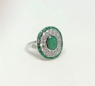 An 18ct white gold emerald and diamond Art Deco style ring,