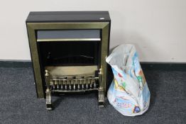 A brass electric fire with coals