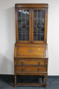 An Edwardian oak bureau bookcase