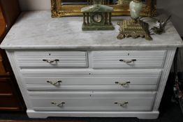 A white marble topped Edwardian four drawer chest