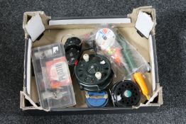 A box of fishing reels,