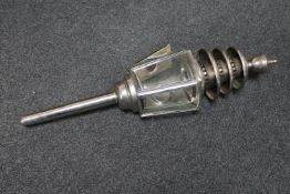 An antique chrome coach lamp