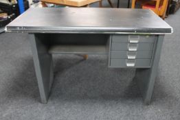 A metal framed writing desk