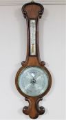 A mahogany cased barometer with silvered dial