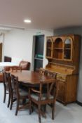 An eight piece Ducal pine dining room suite comprising of dresser,