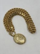 A Victorian gold locket on contemporary chain CONDITION REPORT: 42.8g.