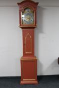 An antique painted longcase clock with brass and silvered dial