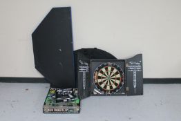 Three table top poker tables together with a Texas Hold 'Em poker set and a dartboard in cabinet