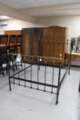 A Victorian brass and cast iron bed