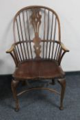 An elm Windsor kitchen armchair