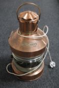 A brass and copper ship's top light by M.