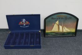 A Grand Vins De Bordeaux wooden six bottle wine box together with a wooden relief panel - America,