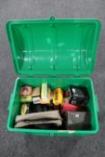 A plastic storage box of assorted cameras, lens cases,