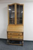 An early 20th century oak bureau bookcase