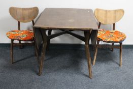 A mid 20th century teak G Plan sideboard together with a drop leaf table and two chairs