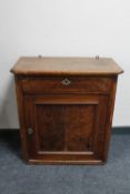 A 19th century mahogany cupboard fitted a drawer above