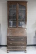 A 1930's oak bureau bookcase