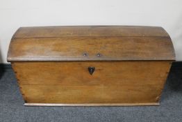 A 19th century oak dome topped shipping trunk