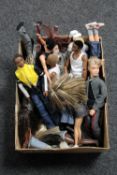 A box of assorted plastic dolls