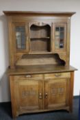 An antique continental oak kitchen dresser