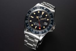 A RARE GENTLEMAN'S STAINLESS STEEL ROLEX OYSTER PERPETUAL GMT MASTER BRACELET WATCH CIRCA 1973, REF.
