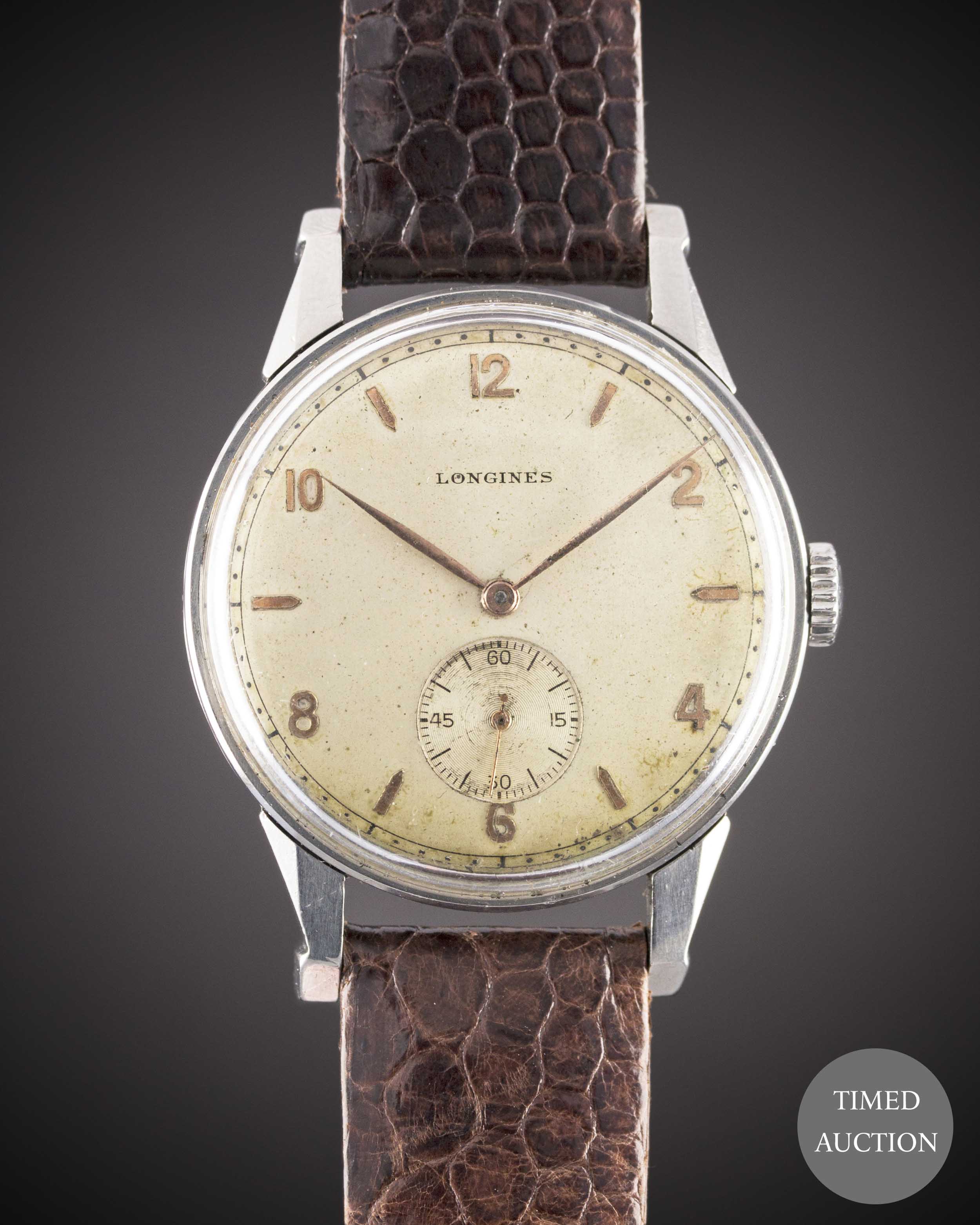 A GENTLEMAN'S LARGE SIZE STAINLESS STEEL LONGINES WRIST WATCH CIRCA 1948, REF. 23770 WITH "PINCER"