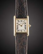 A LADIES 18K SOLID GOLD CARTIER PARIS TANK WRIST WATCH CIRCA 1980s Movement: 17J, manual wind,