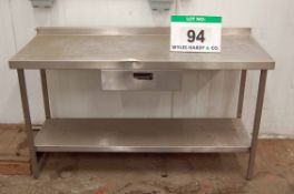 An 150cm x 60cm Stainless Steel Side Table fitted Single Drawer and Under Shelf (NOTE: Dent to