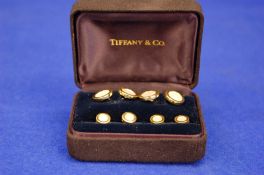 A TIFFANY & CO. 18ct Gold and Mother of Pearl Contemporary Dress Studs and matching Pair of Double