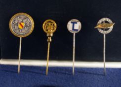 A Protective Case containing Four Lapel Pins, One bearing the words “Badischer Tennis Verband” (