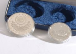 A Blue Protective Case containing Two Silver Coins (Proof Set) One bearing a Relief of a Women’s