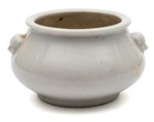 A small Chinese blanc de chine censer: of compressed globular form with mask head handles, 10.