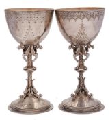 A near matching pair of silver wine goblets, maker Elkington & Co, London,