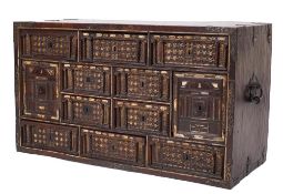 A 17th Century Spanish walnut, ivory inlaid and brass mounted Vargueno:, bordered with ivory lines,