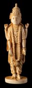 A late 19th / early 20th Century carved ivory figure of Vishnu: in traditional costume with four