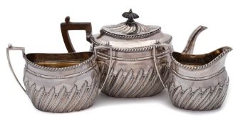 A Victorian bachelor's silver three-piece tea service, maker WPD, Sheffield,