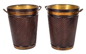 A pair of mahogany spirally reeded and brass banded twin-handled buckets of large size in the 18th