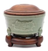 A Chinese Longquan celadon tripod censer: of flared cylindrical form with flattened rim,
